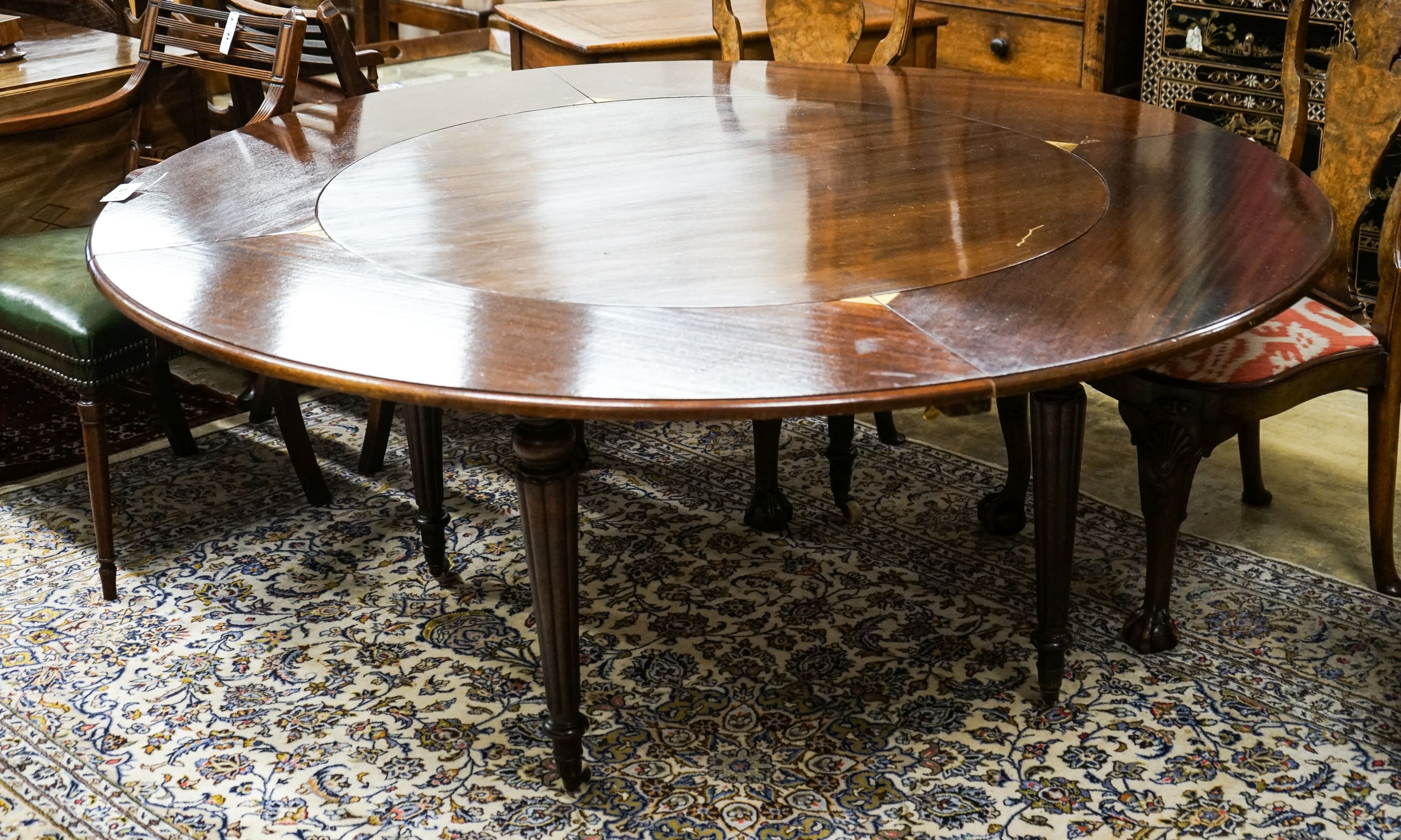 A Victorian and later circular mahogany extending dining table, 170cm diameter, height 70cm